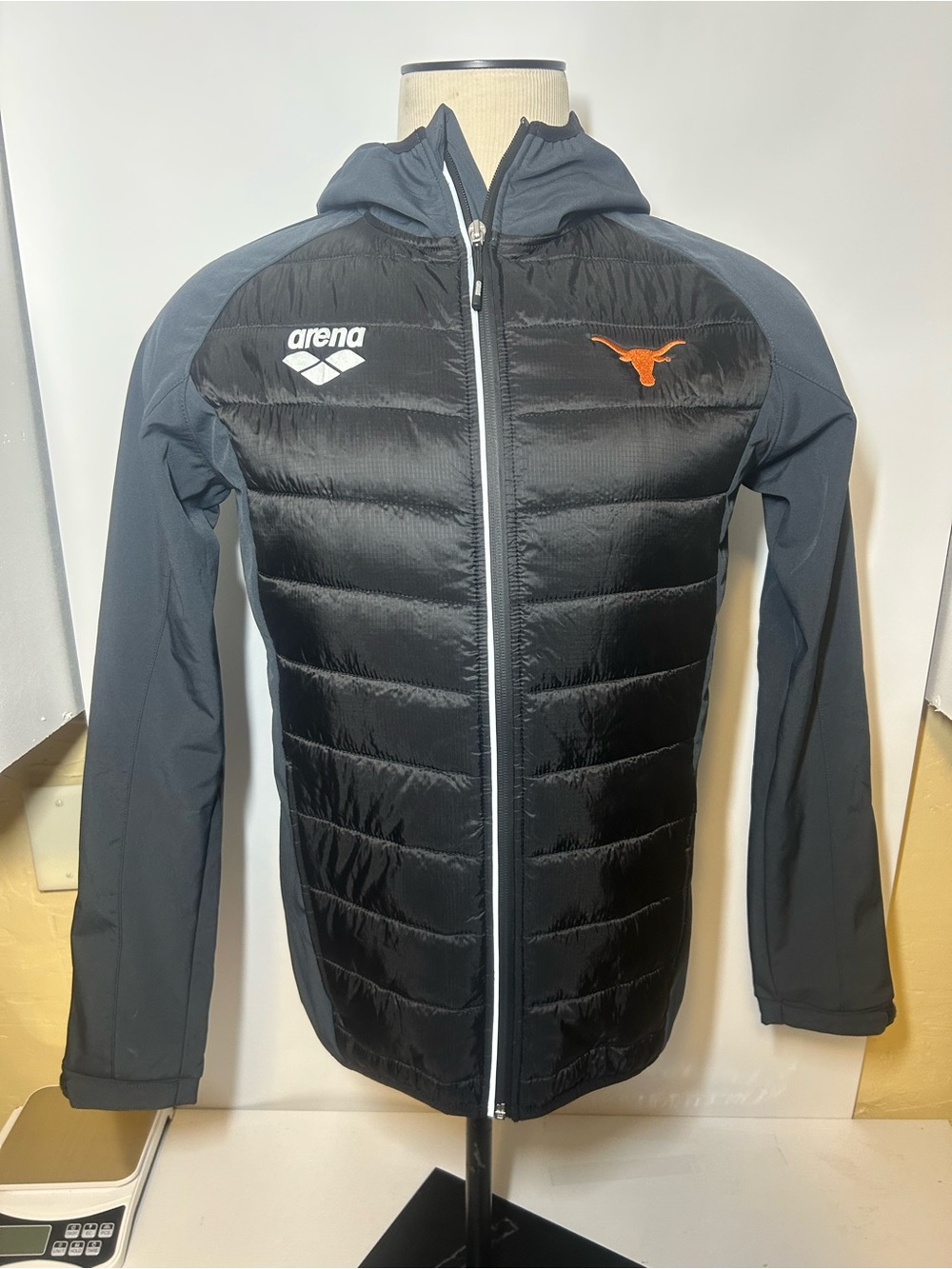 Arena Black Puffer Jacket with Gray Sleeves and Orange Longhorn Logo team line